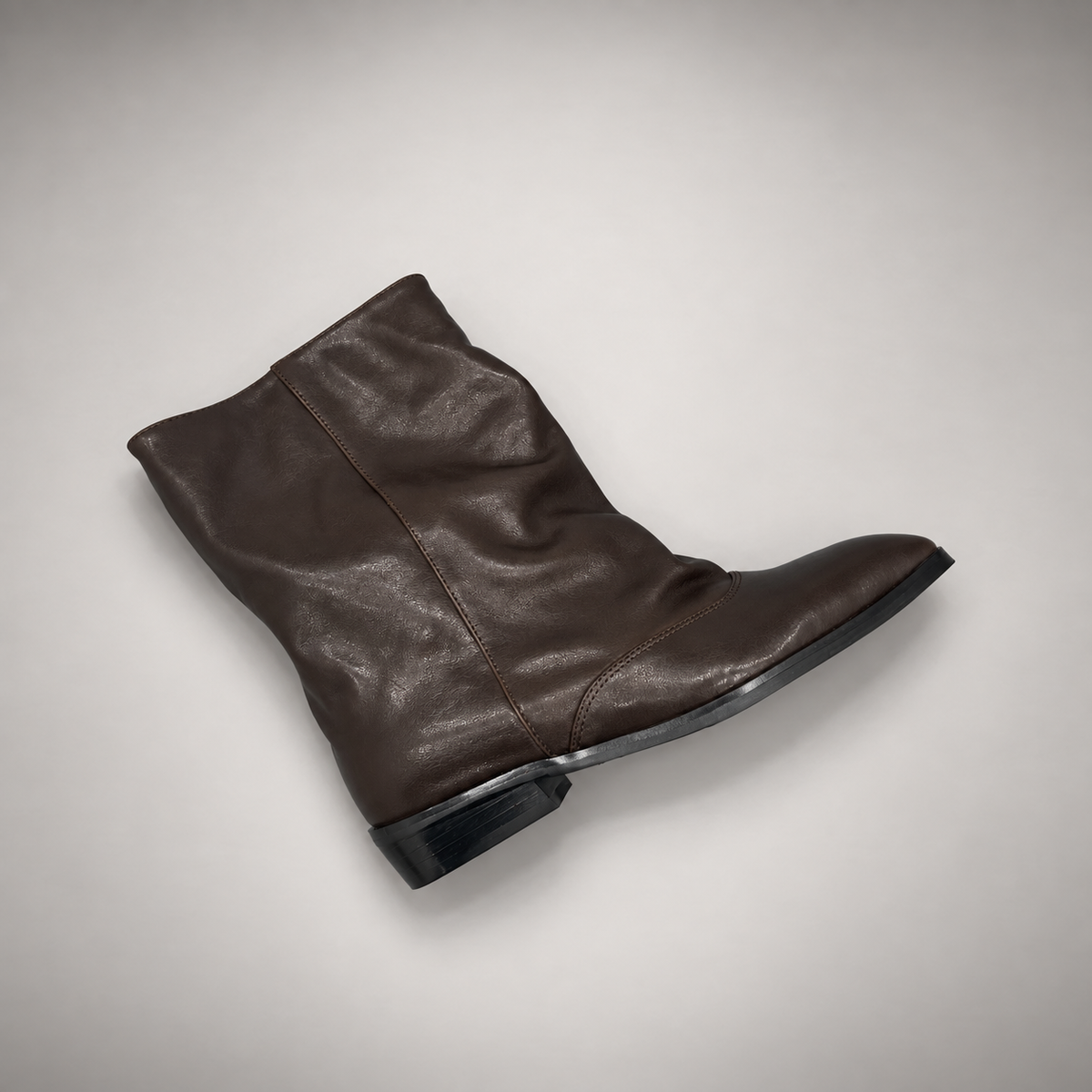 Dark taupe draped leather fold-over mid-calf boots - texture