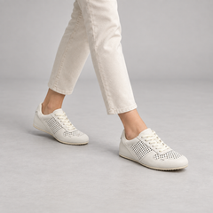 White perforated leather sneakers, on-foot view