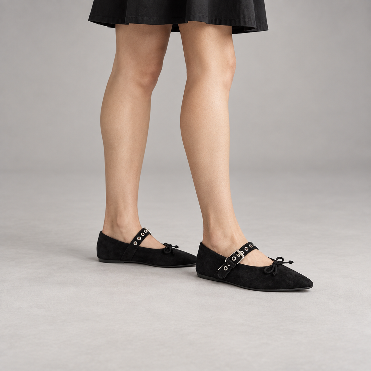 Black buckle-strap suede flats, on-foot view