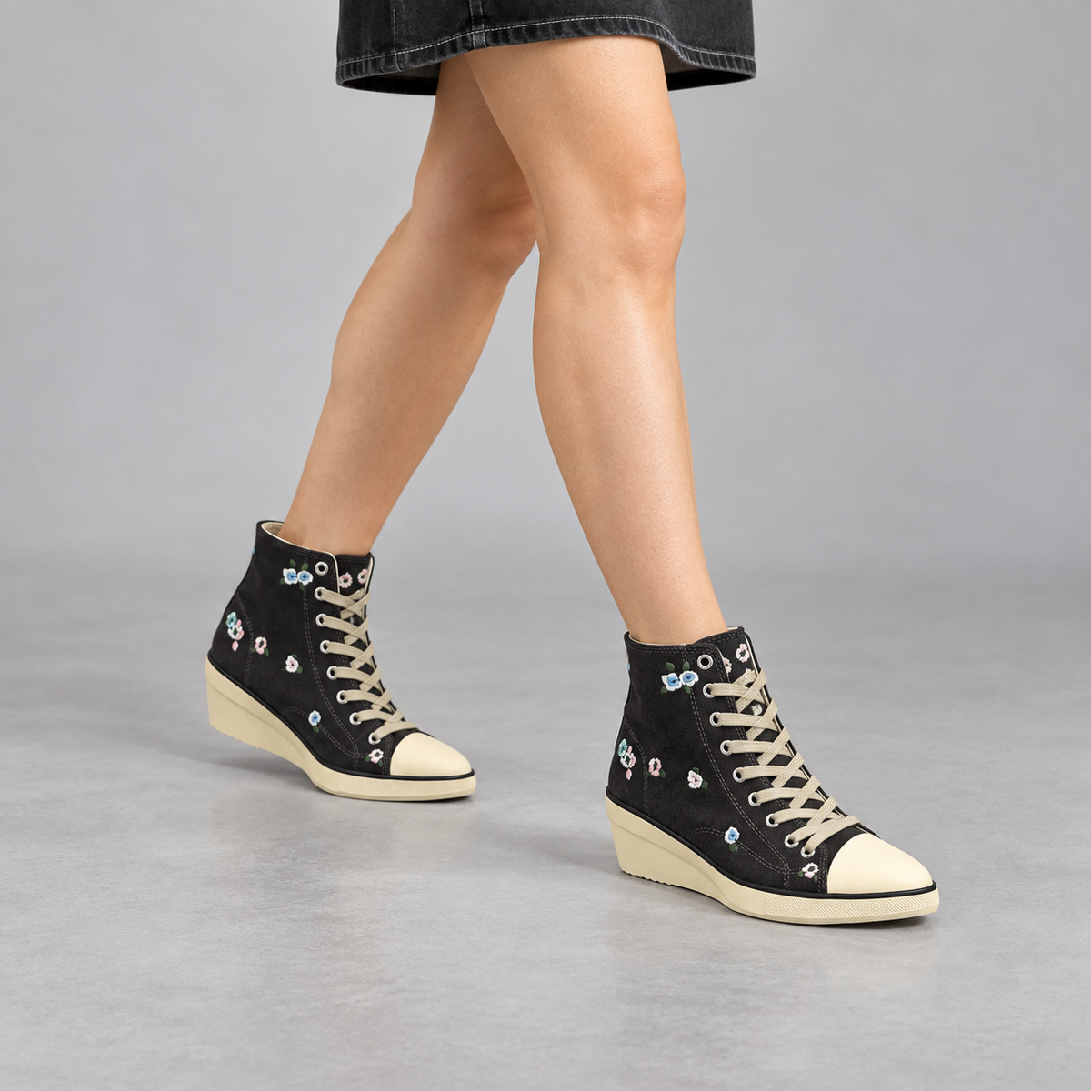 Black floral embroidered canvas wedge sneakers, on-foot view