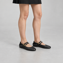 Black double-buckle leather Mary Jane flats, on-foot view