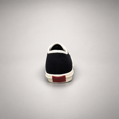 Black canvas lace-up sneakers, back view