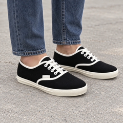 Black canvas lace-up sneakers, square on-foot view