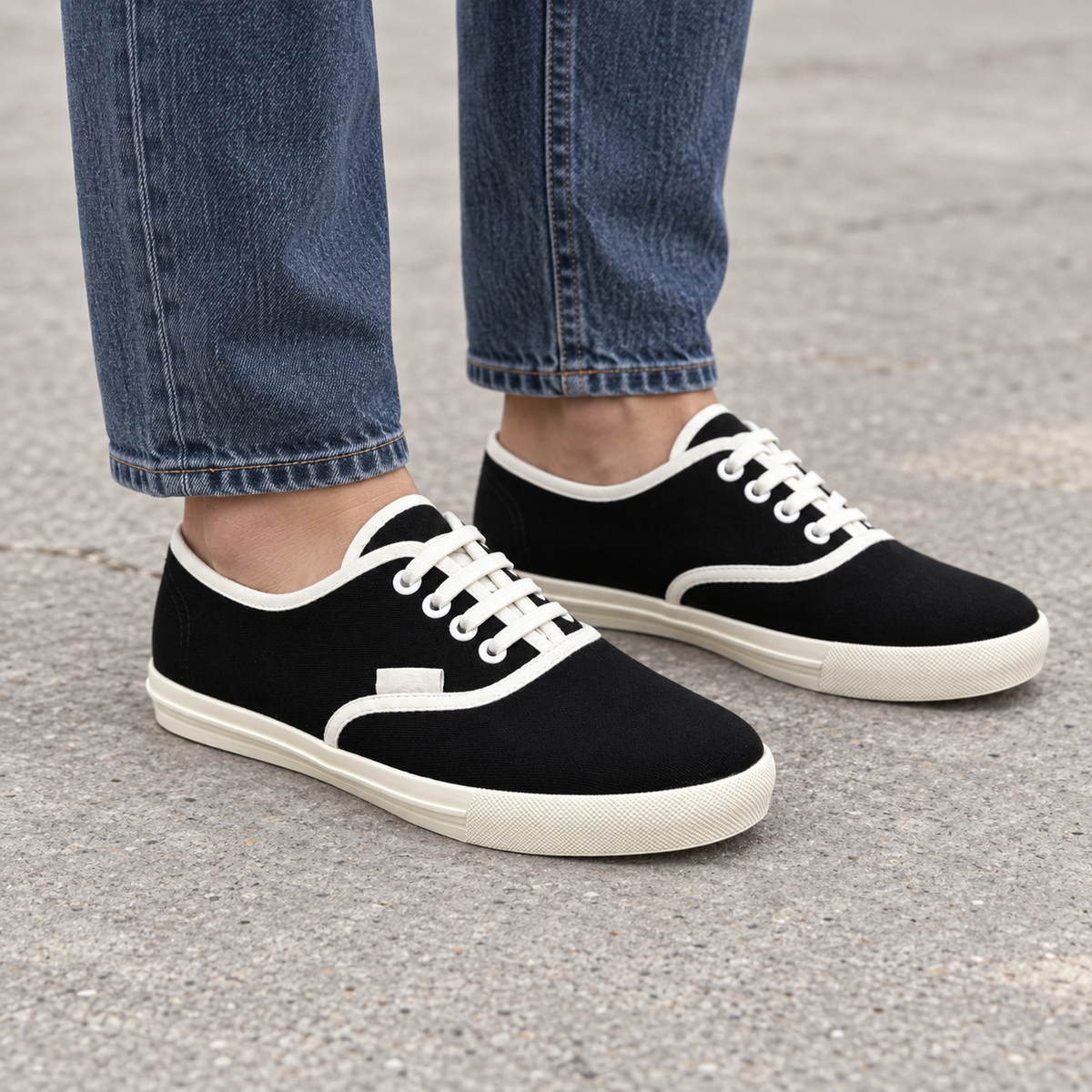 Black canvas lace-up sneakers, square on-foot view