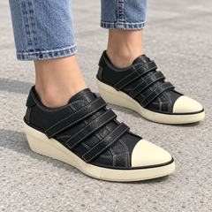 Black triple-strap wedge sneakers, square on-foot view