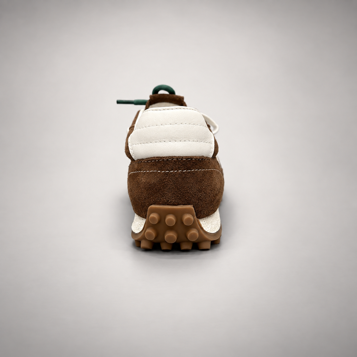 Dark brown suede sneakers, back view