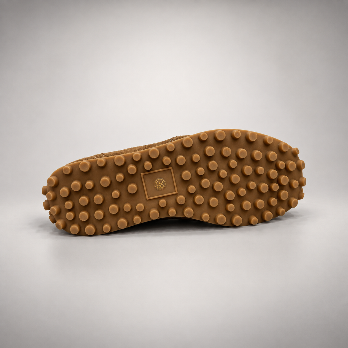 Dark brown suede sneakers, sole view
