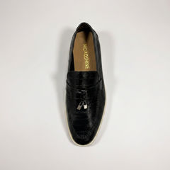 Black loafer top view showing an eel-pattern embossed vamp and tassel detail