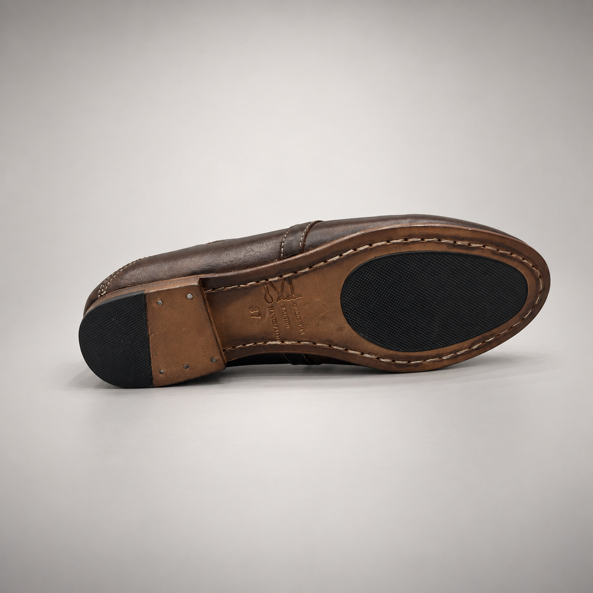 Dark brown washed leather horsebit loafer outsole view