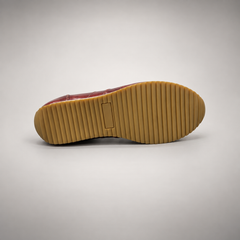 Burgundy low-top lace-up sneaker outsole view