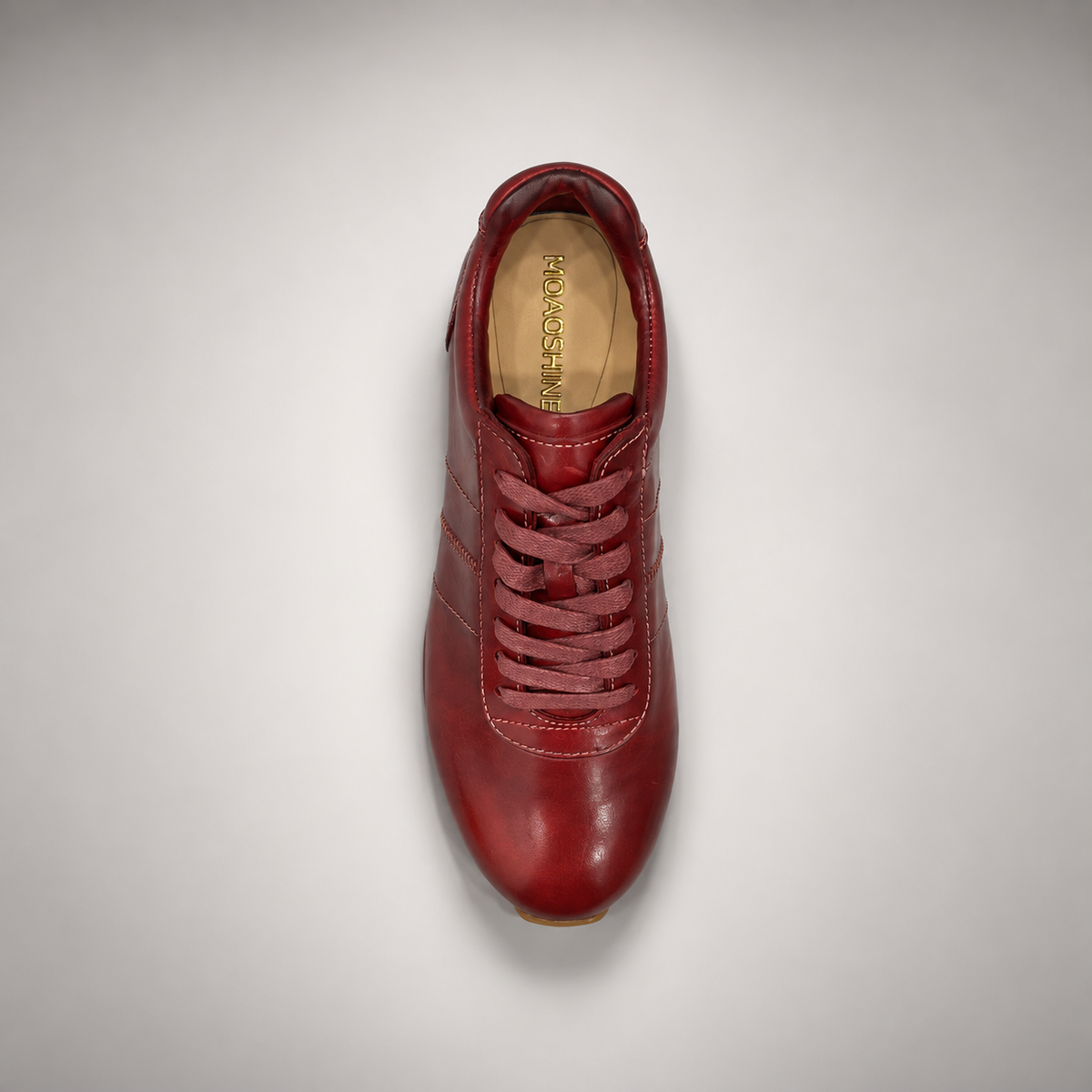 Burgundy low-top lace-up sneaker top view