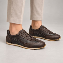 Black washed leather lace-up sneakers worn on foot