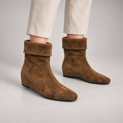Brown suede fold-over mid-calf boots worn on foot