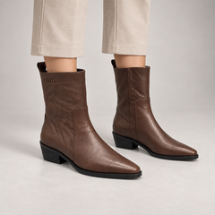 Brown leather mid-calf boots worn on foot