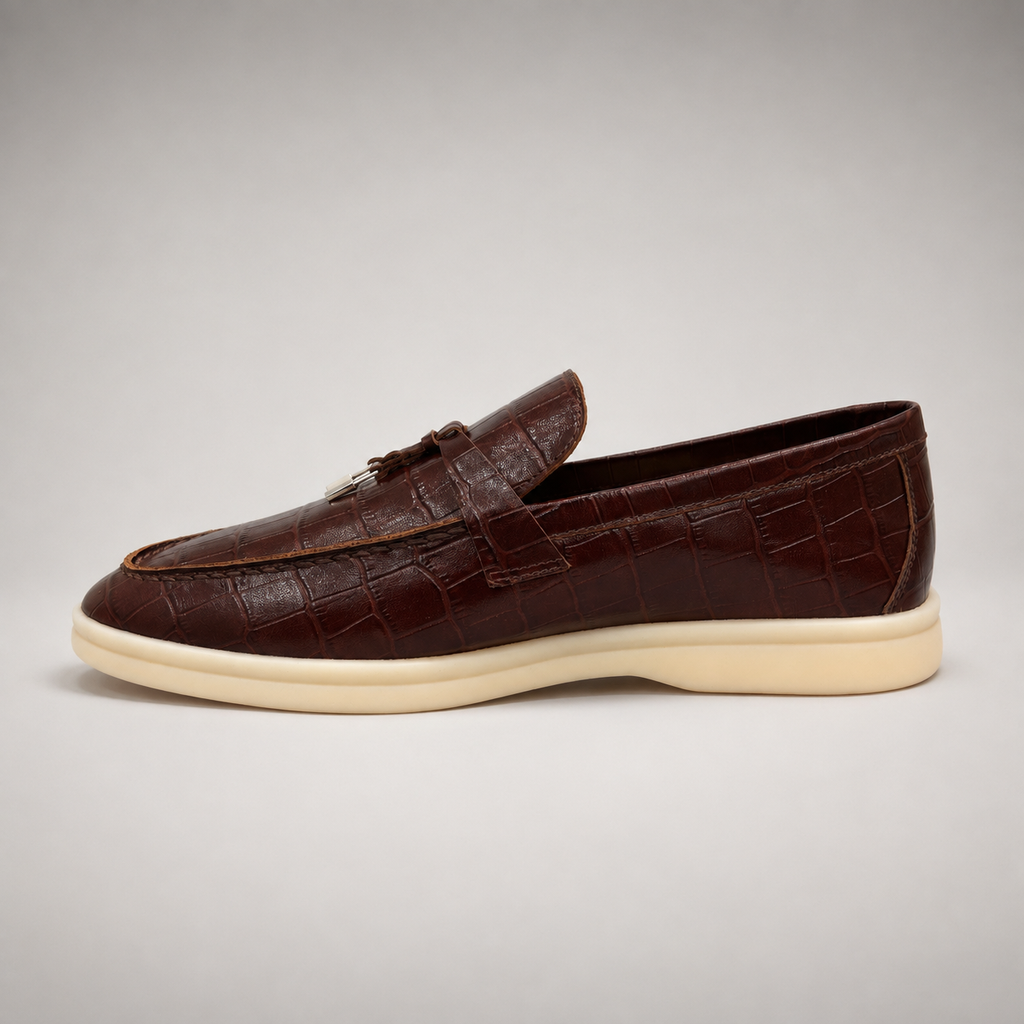 Brown loafer opposite side profile showing a crocodile-pattern embossed upper and vamp strap