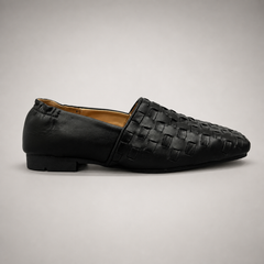 Black woven loafer side profile showing a woven slip-on upper