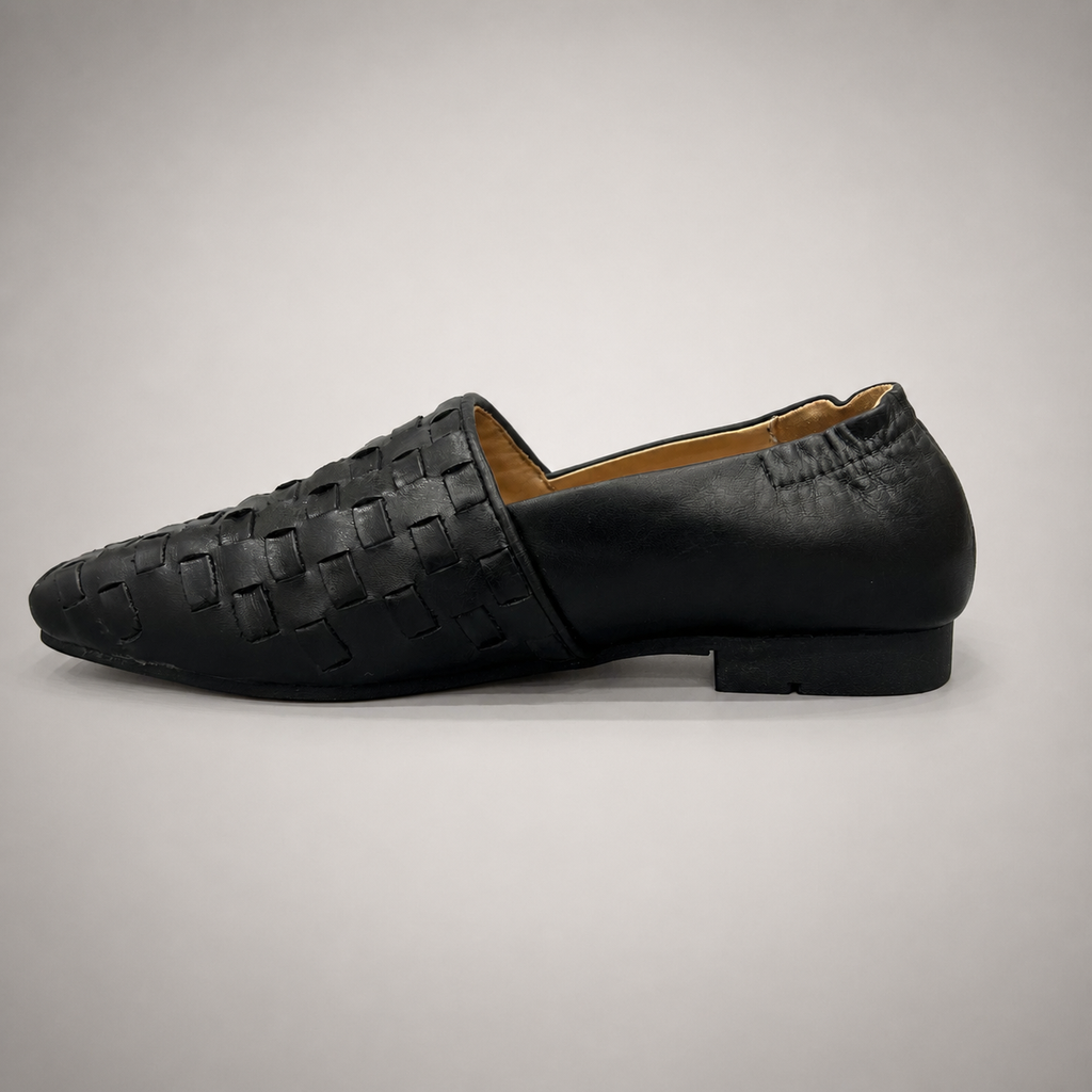 Black woven loafer opposite side profile showing a woven slip-on upper
