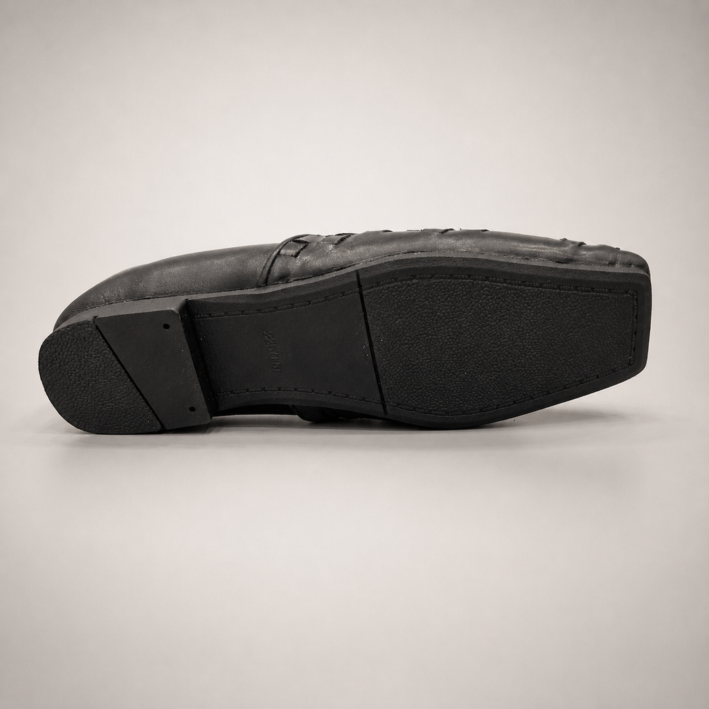 Black woven loafer outsole view showing the cow leather outsole
