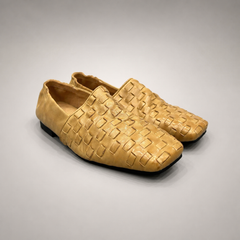 Gold woven loafer pair three-quarter view showing a woven slip-on upper