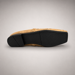 Gold woven loafer rear view showing a woven slip-on upper
