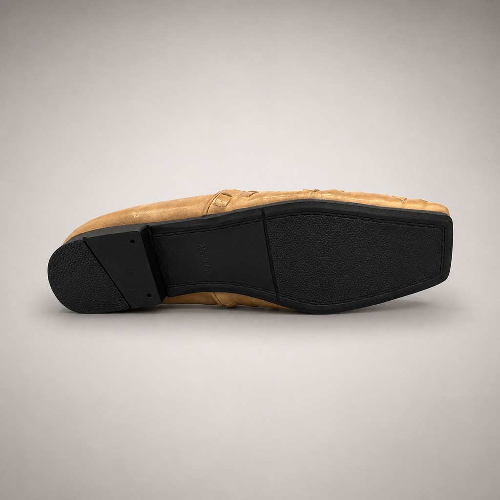 Gold woven loafer rear view showing a woven slip-on upper