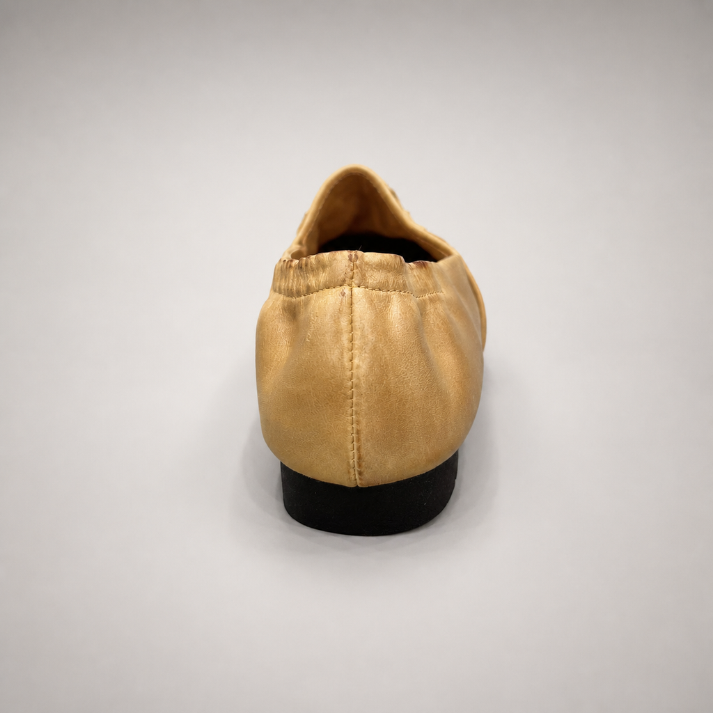 Gold woven loafer outsole view showing the cow leather outsole