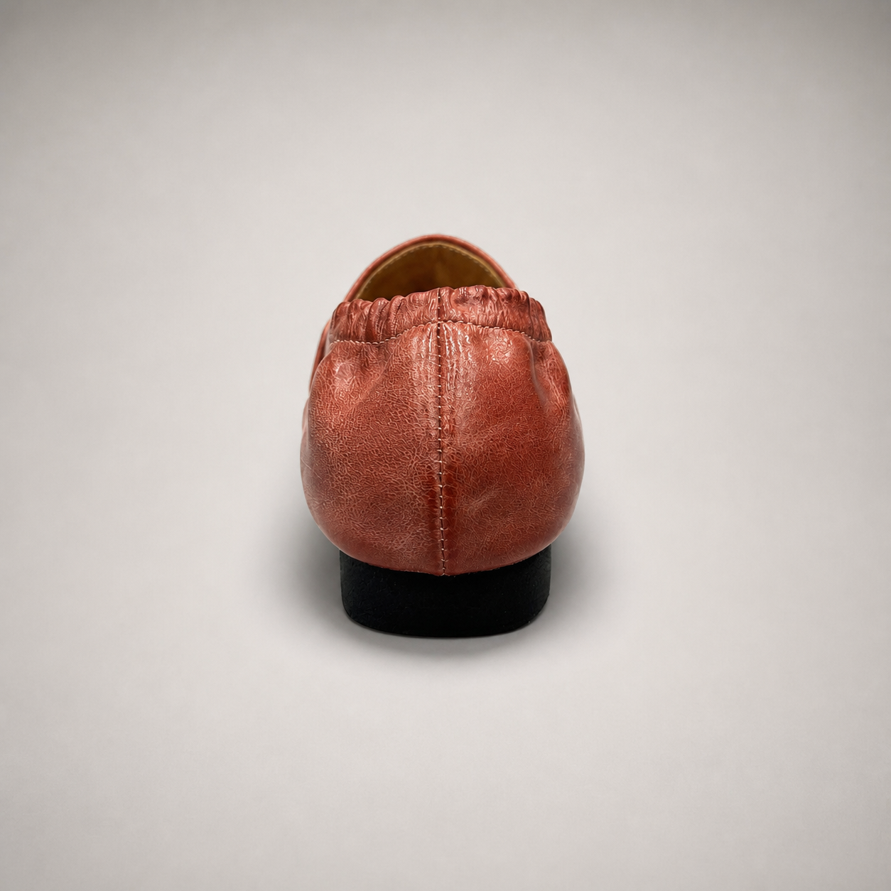 Rust woven loafer top view showing a woven slip-on upper