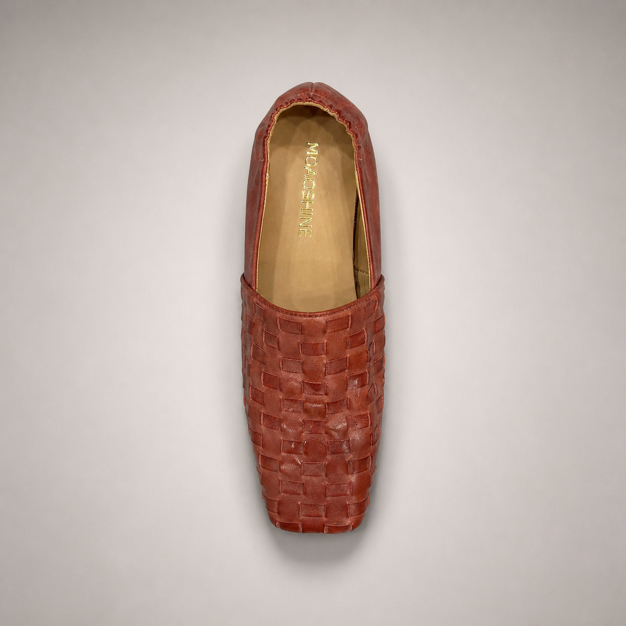 Rust woven loafer outsole view showing the cow leather outsole