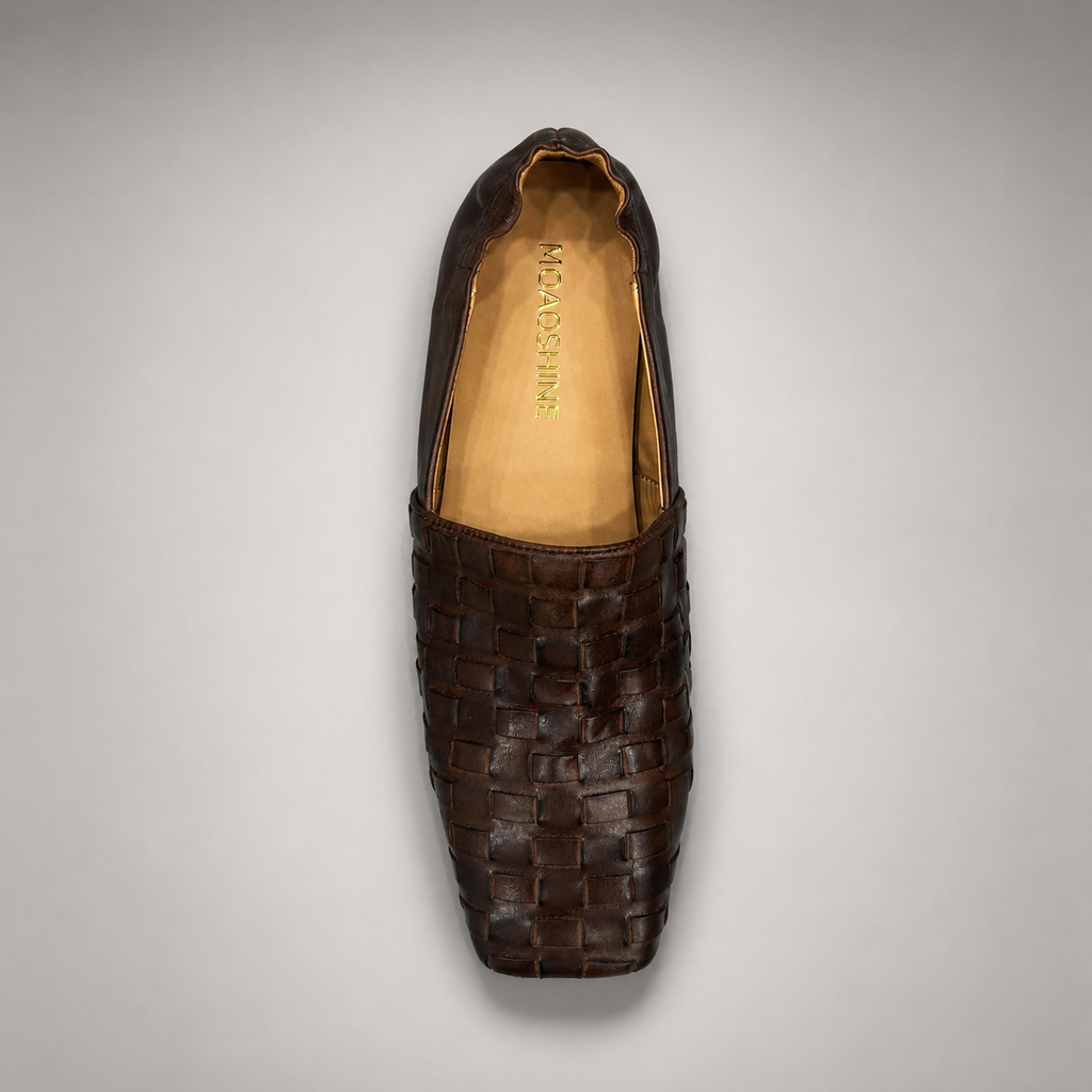 Brown woven loafer rear view showing a woven slip-on upper