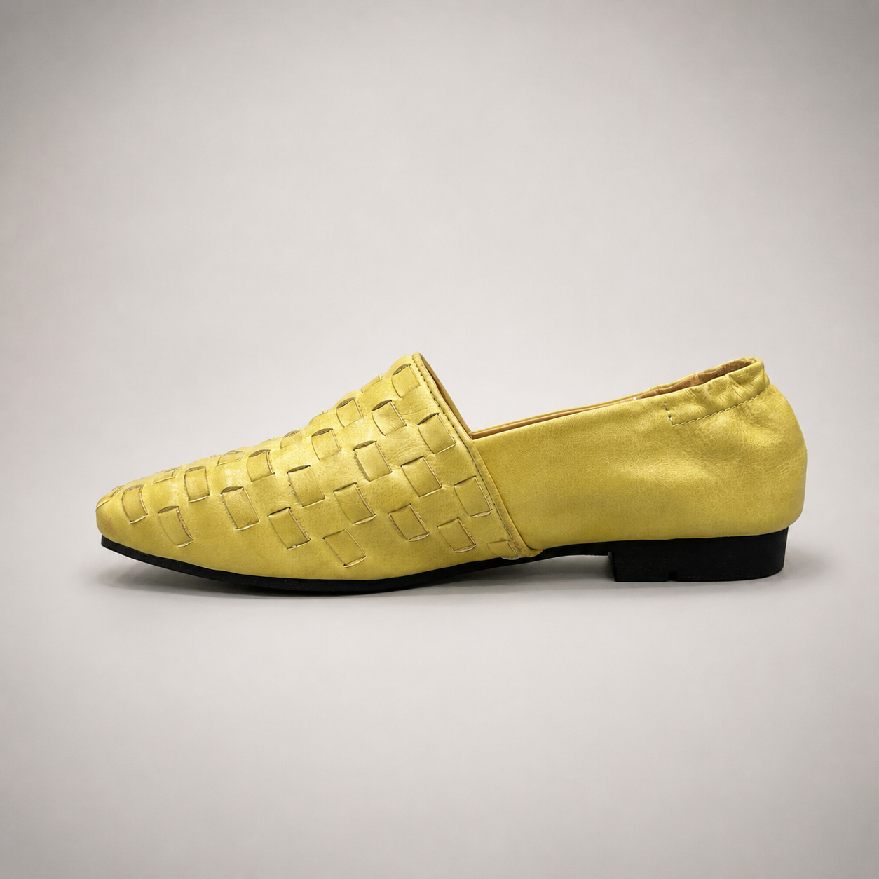 Yellow woven loafer opposite side profile showing a woven slip-on upper