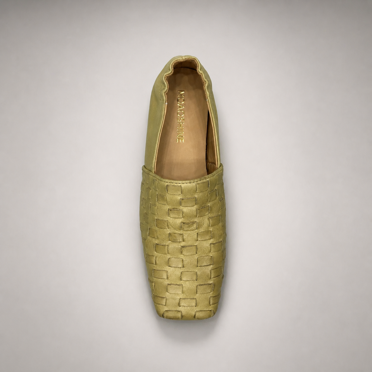 Yellow woven loafer rear view showing a woven slip-on upper