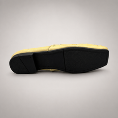 Yellow woven loafer top view showing a woven slip-on upper