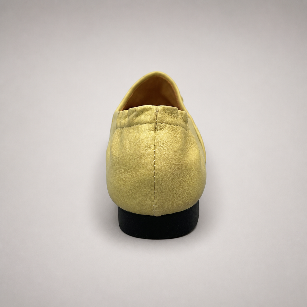 Yellow woven loafer outsole view showing the cow leather outsole