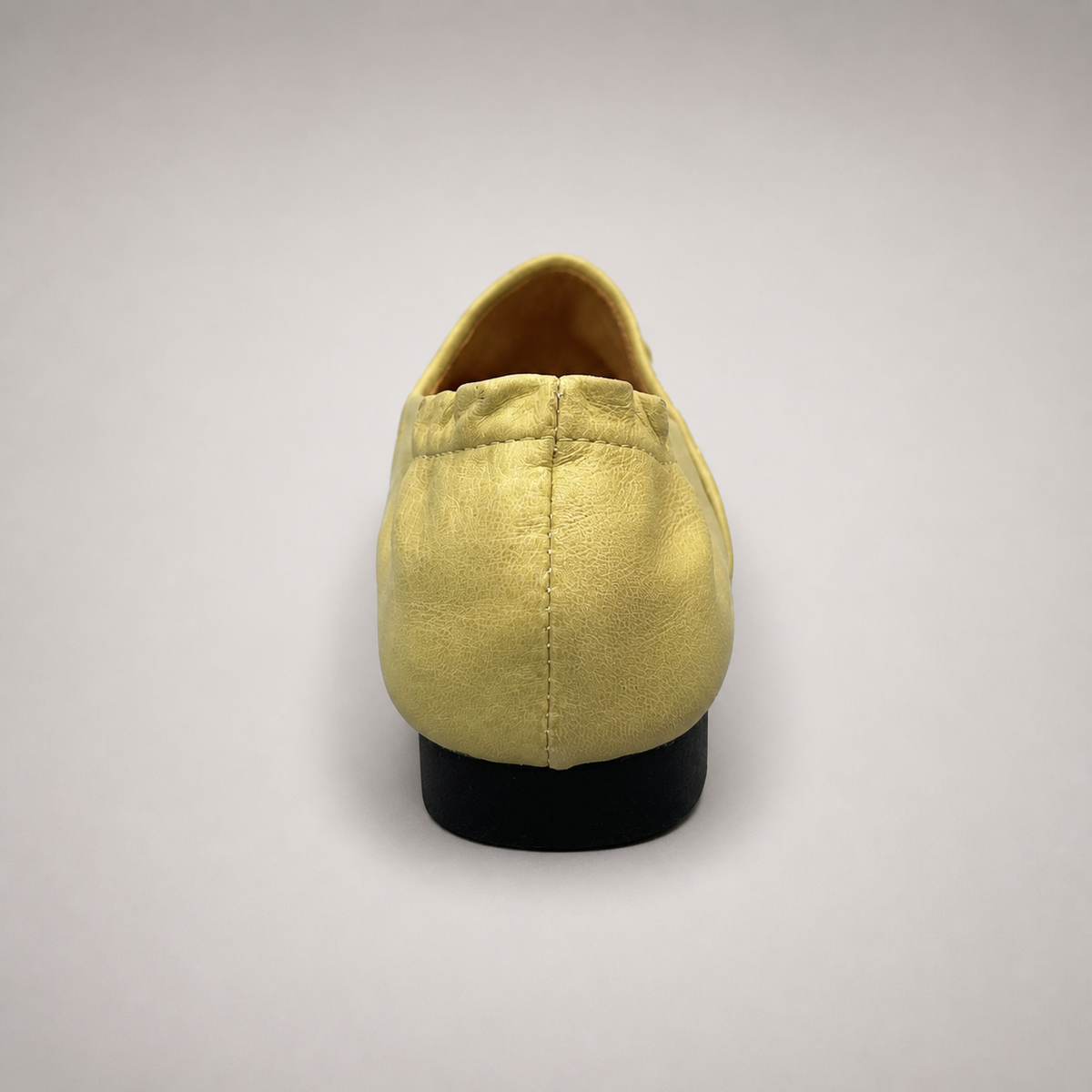 Yellow woven loafer outsole view showing the cow leather outsole