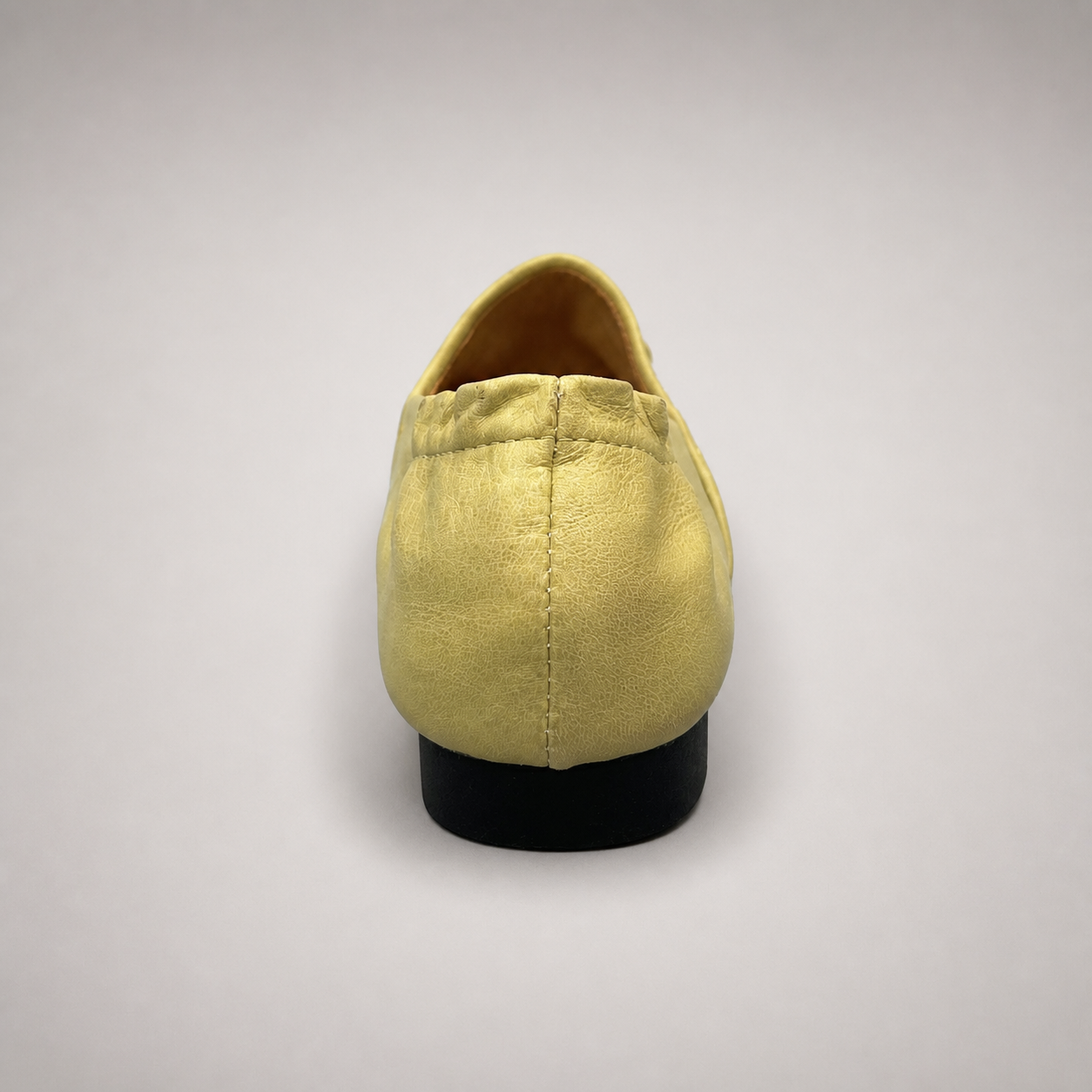 Yellow woven loafer outsole view showing the cow leather outsole