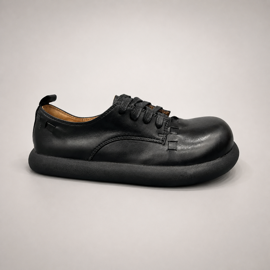 Black lace-up shoe second pair angle showing a lace-up construction
