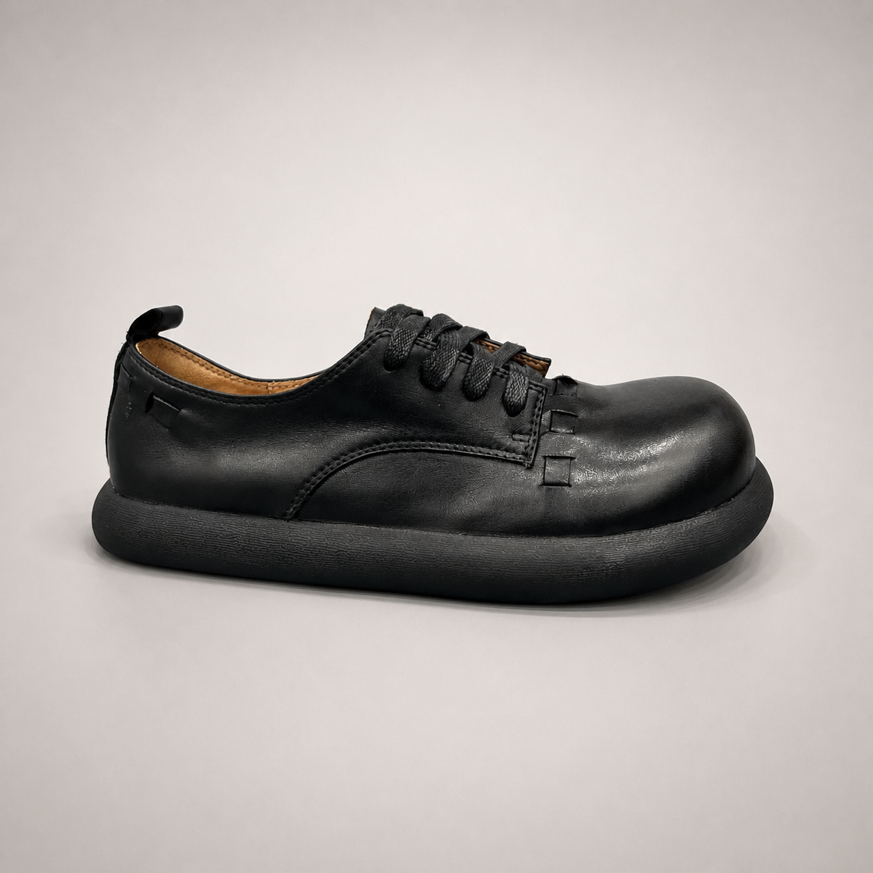 Black lace-up shoe second pair angle showing a lace-up construction