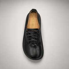 Black lace-up shoe top view showing a lace-up construction