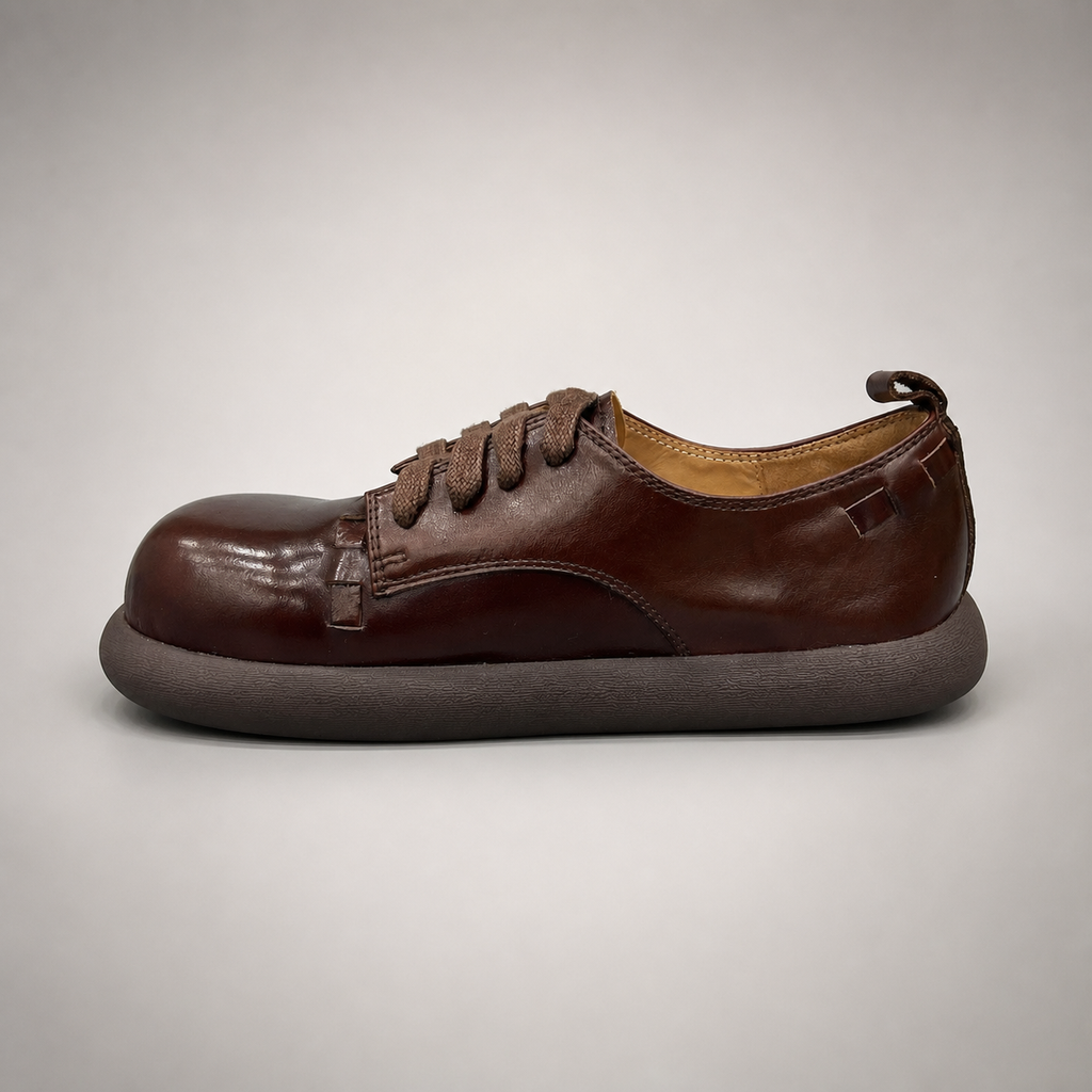 Brown lace-up shoe side profile showing a lace-up construction
