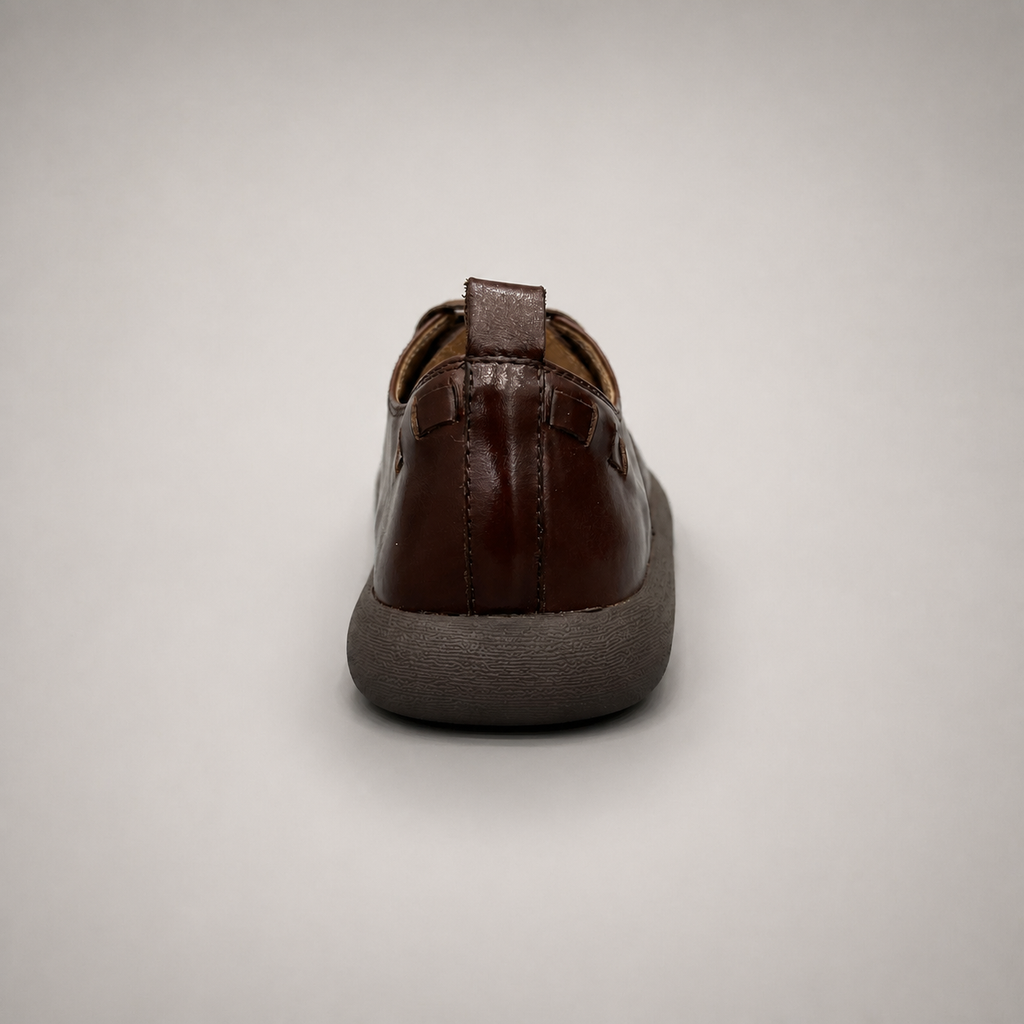 Brown lace-up shoe rear view showing a lace-up construction