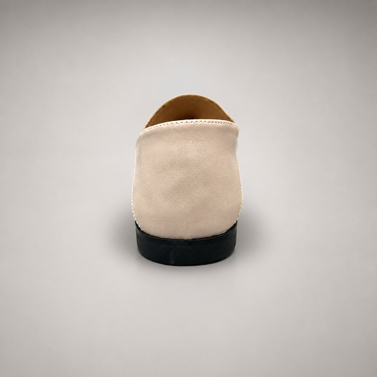 Ivory loafer rear view showing a metal accent across the vamp