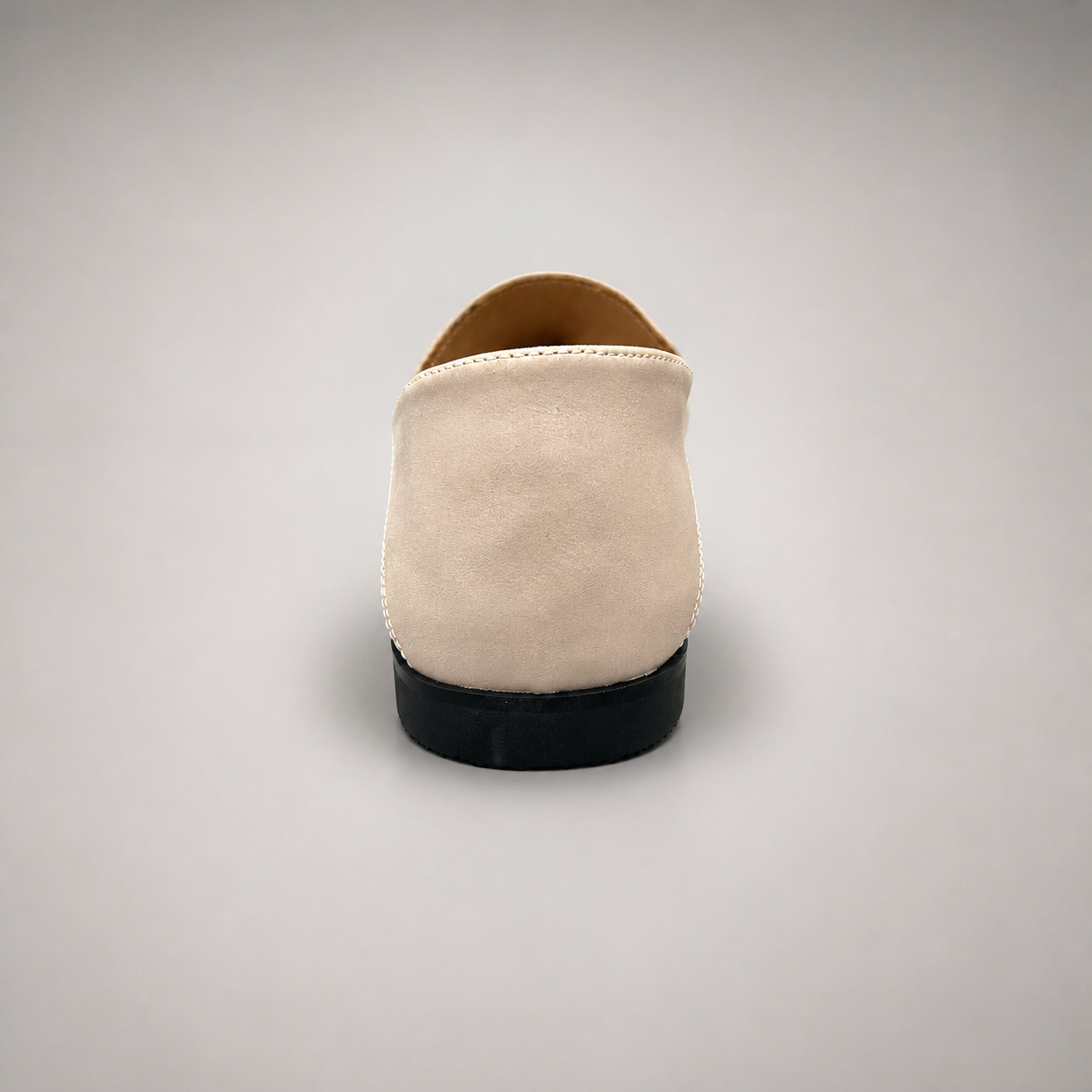 Ivory loafer rear view showing a metal accent across the vamp