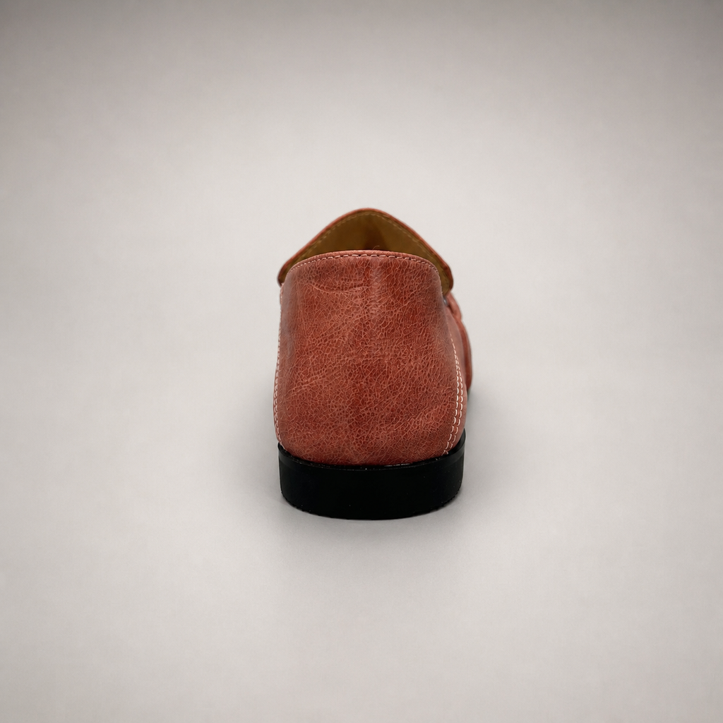 Rust loafer rear view showing a metal accent across the vamp