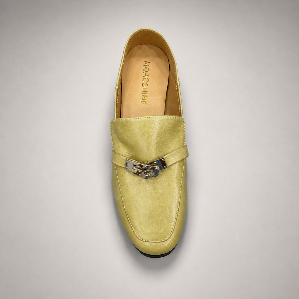 Yellow loafer top view showing a metal accent across the vamp