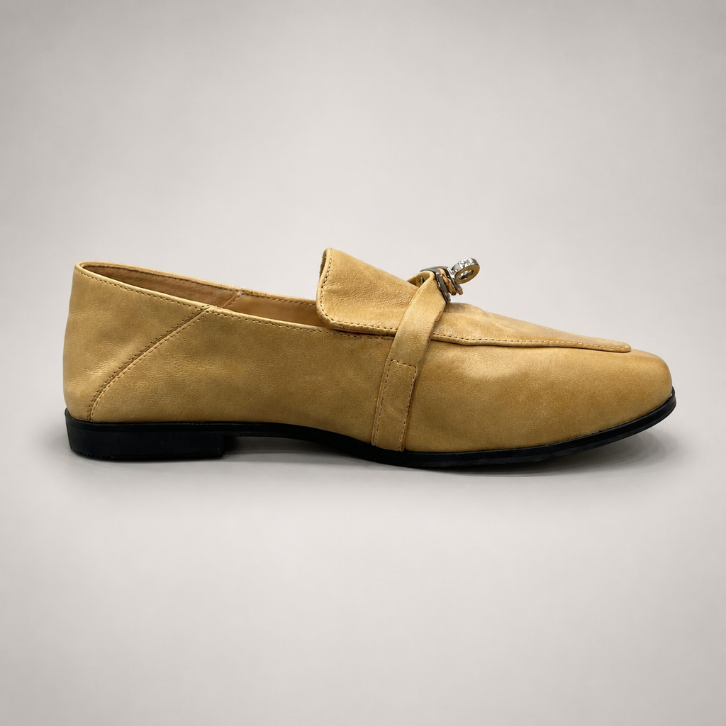 Tan loafer opposite side profile showing a metal accent across the vamp