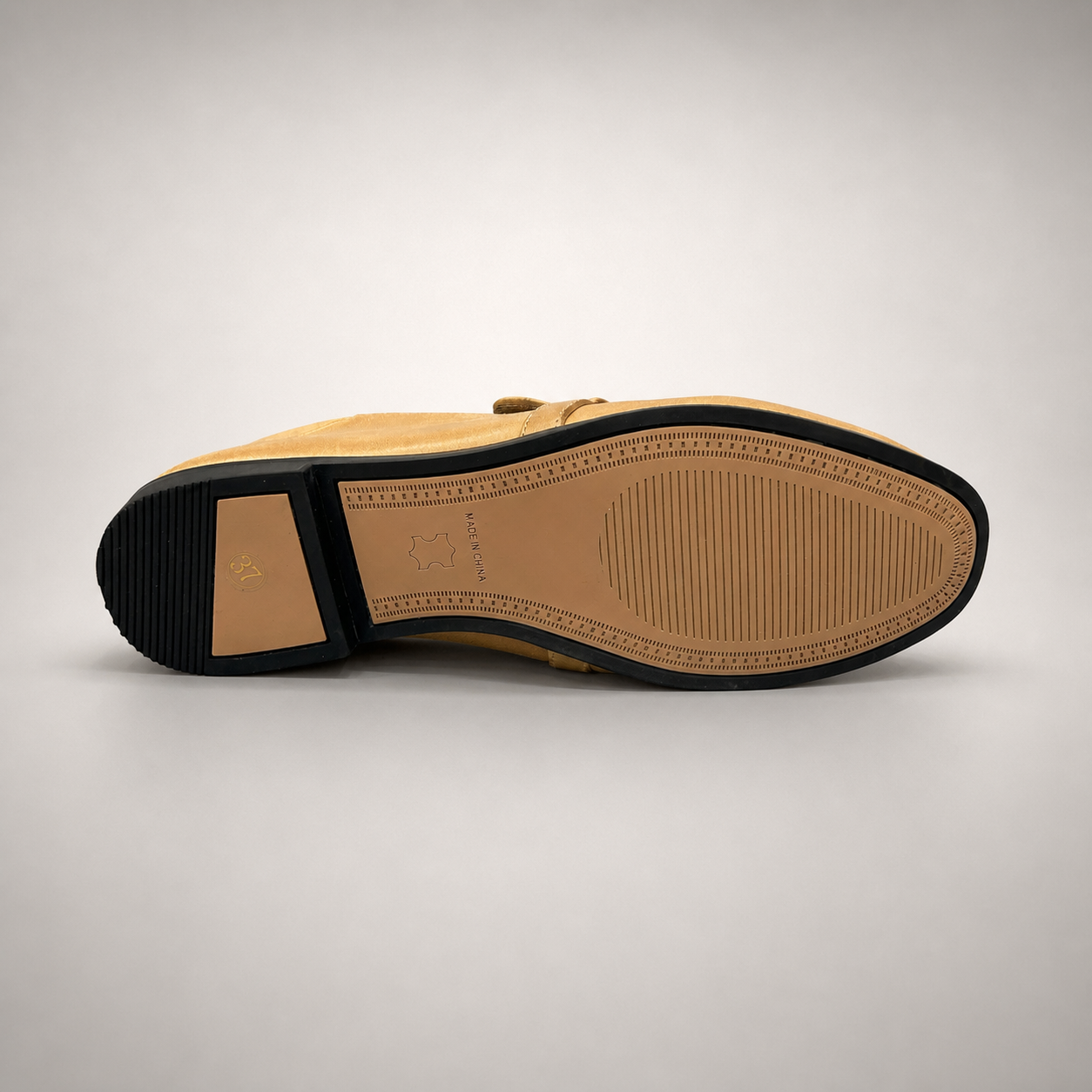 Tan loafer outsole view showing the cow leather outsole