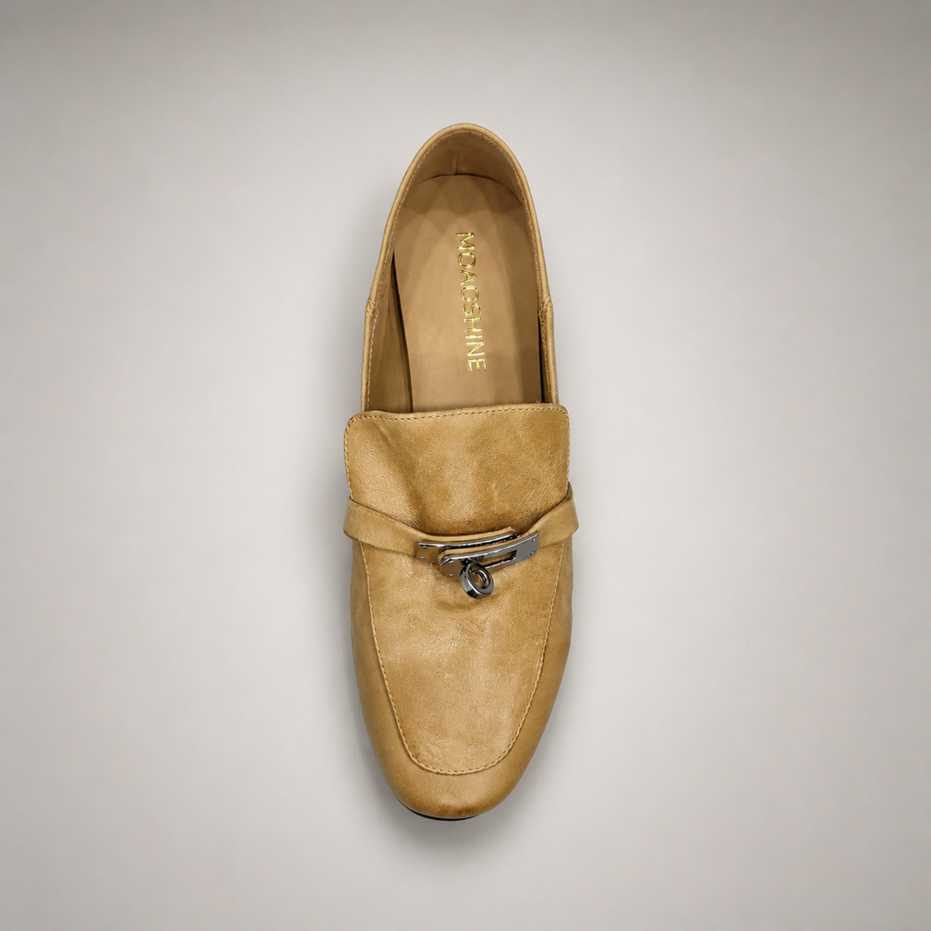 Tan loafer top view showing a metal accent across the vamp