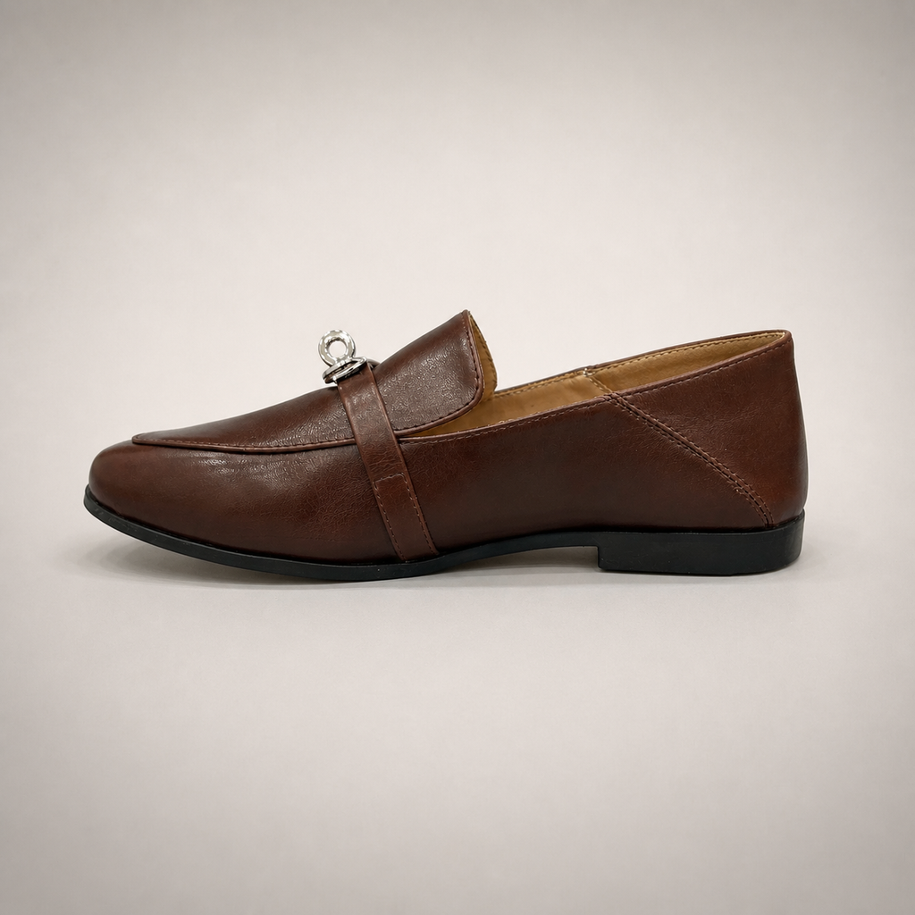 Brown loafer opposite side profile showing a metal accent across the vamp