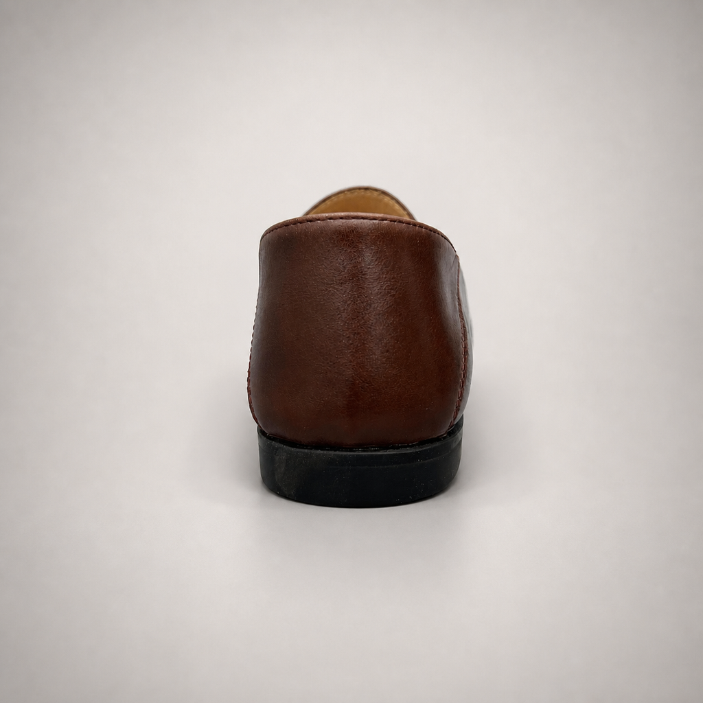 Brown loafer top view showing a metal accent across the vamp