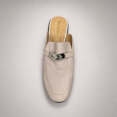 Ivory mule loafer rear view showing an open-back mule construction and metal vamp accent